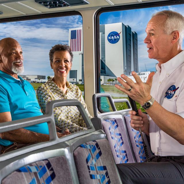 Kennedy Space Center guide on tour bus