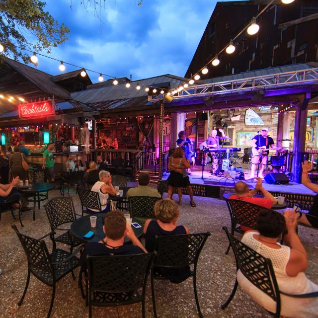 A crowd enjoying live music in the courtyard at House of Blues.