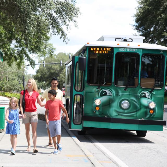 I-Ride Trolley Services family at bus stop