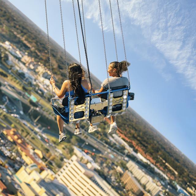 Two friends riding the Orlando Starflyer at ICON Park