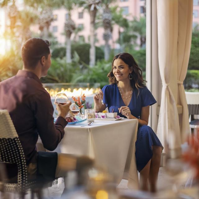 Couple dining on patio of The Venetian Chophouse at Caribe Royale Orlando