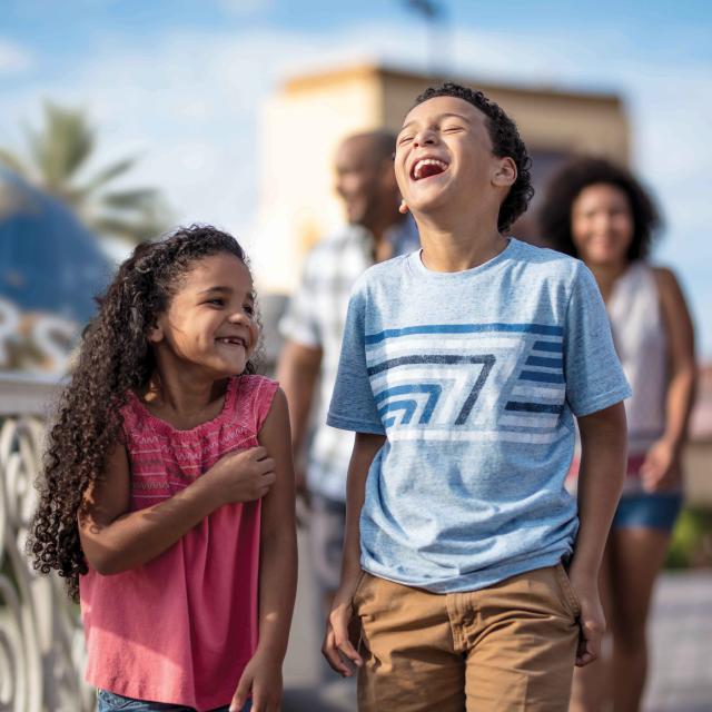 Kids laugh as they walk together while enjoying Universal Orlando Resort