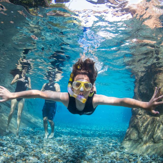 A woman snorkeling at Discovery Cove Wind-Away River