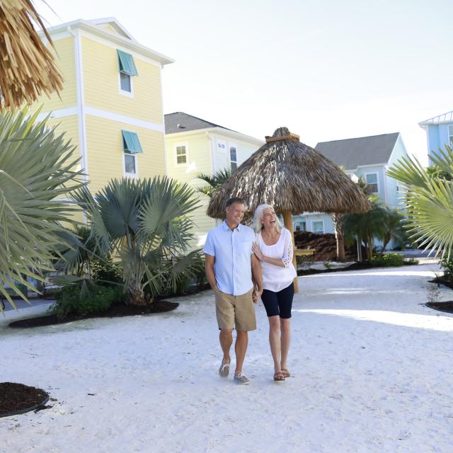 Margaritaville Resort Orlando couple walking along cottages