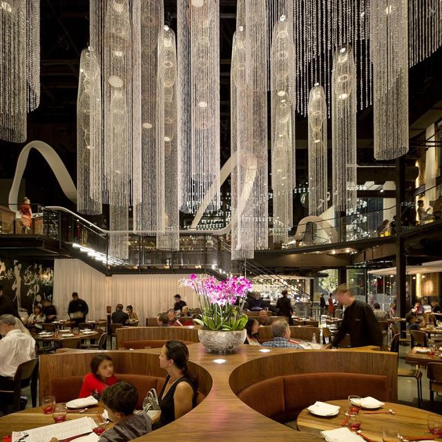 Guests dining inside the lavish Morimoto Asia restaurant in Disney Springs