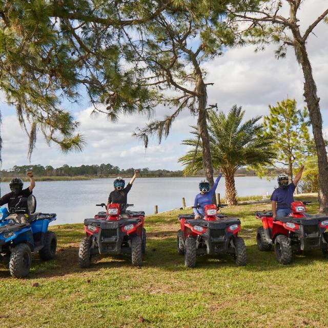 Revolution Off Road group of ATV riders by water