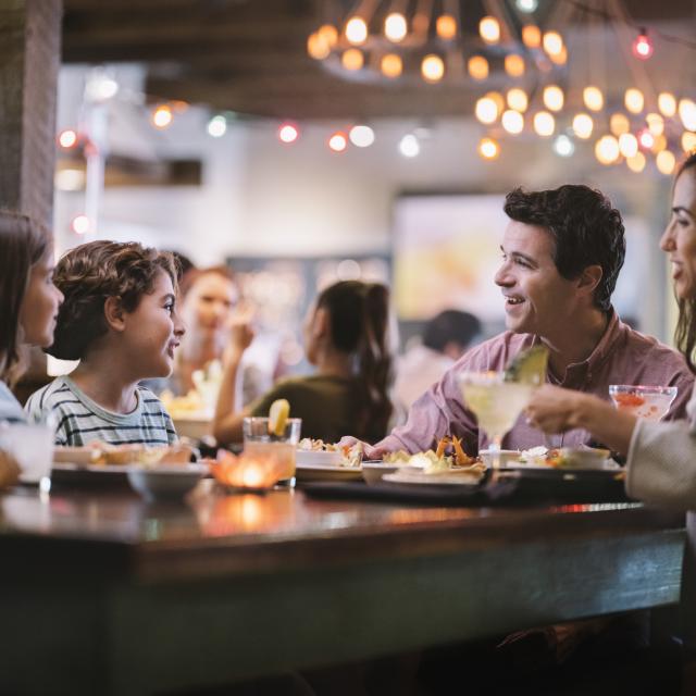 A family of four dining at Uncle Julio's at ICON Park