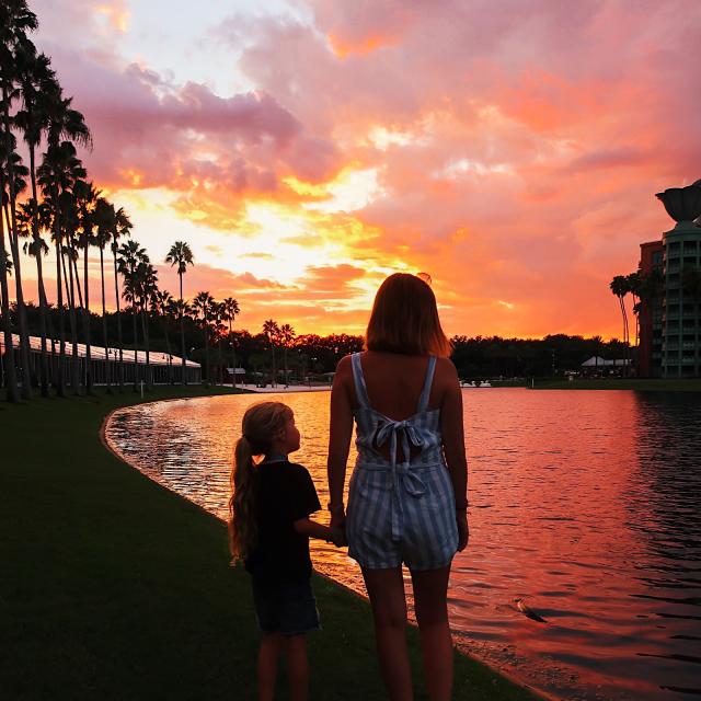 Influencer Katie Ellison and her family watch the sunset on a lake