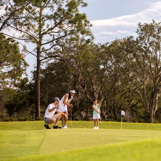 Tranquilo Golf Club at Four Seasons Resort Orlando family on putting course