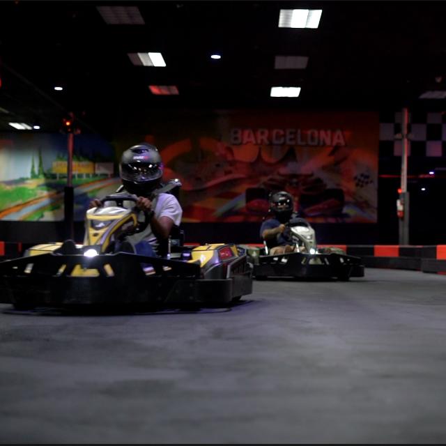 Two karts racing at Karting Orlando at Dezerland Park Orlando.