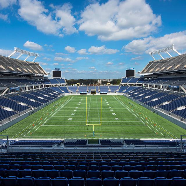 Camping World Stadium setup for a football game during the day
