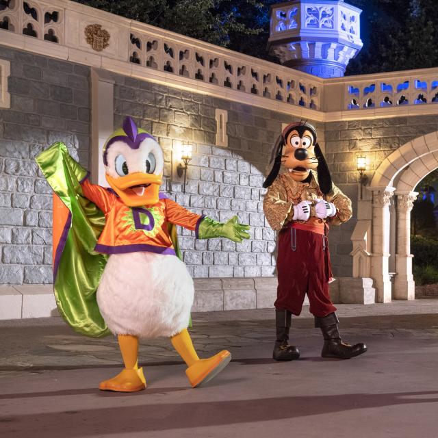 Goofy, Donald and Daisy posing in Halloween costumes at Disney's After Hours Boo Bash