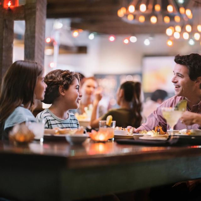 A family of four dining at Uncle Julio's at ICON Park