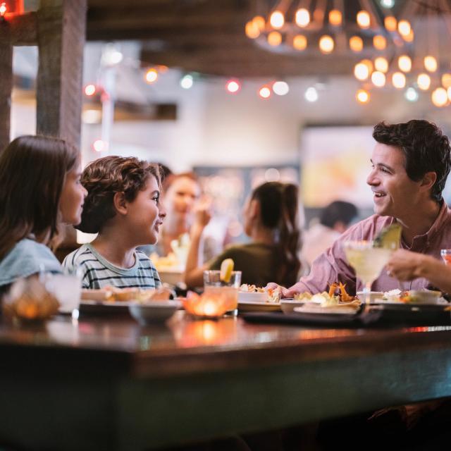 A family of four dining at Uncle Julio's at ICON Park
