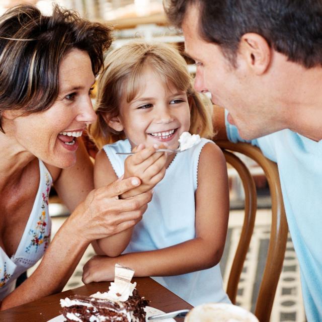 Family eating dessert at a restaurant