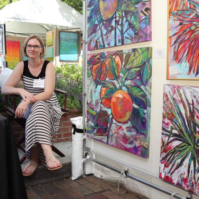 An artist displays her work at the Autumn Art Festival in Winter Park