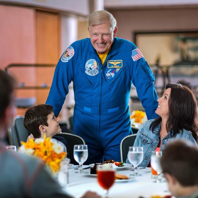 Kennedy Space Center Visitor Complex astronaut with family at meal