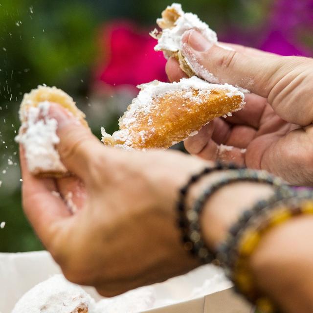 Eating a beignet at Universal Studios Florida Mardi Gras