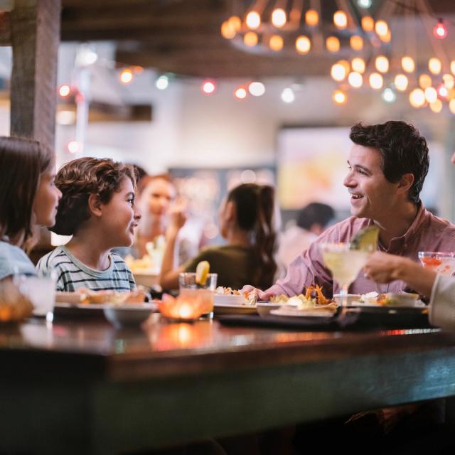 A family of four dining at Uncle Julio's at ICON Park on International Drive in Orlando, Florida.
