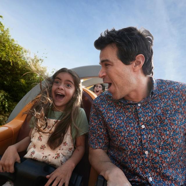 A father and daughter on a Rollercoaster