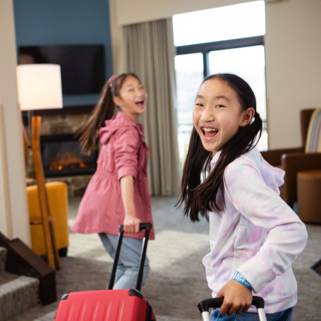 Young girls are excited for their family vacation in the Pocono Mountains