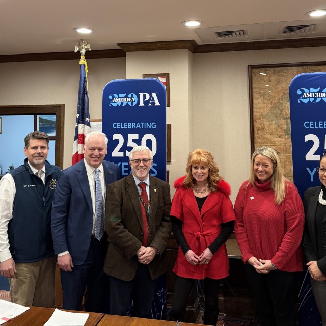 A group posing at Pike County's America250PA kick-off event