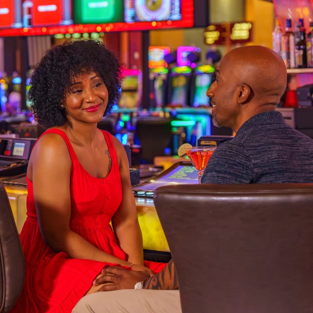 A couple smiling and enjoying each other's company at Mount Airy Casino