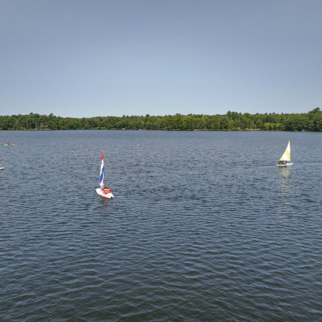 Kids boating on the water at a summer camp