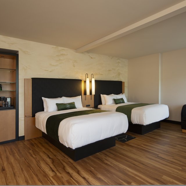 Insite look of a sleeping room with two queen beds at The Swiftwater