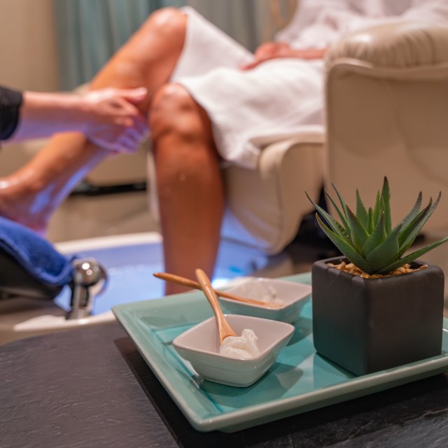 Women relaxing and receiving a pedicure