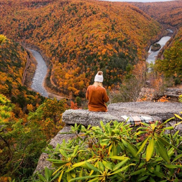 Girl enjoying the fall view at Tank Hollow Overlook in the Poconos