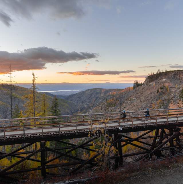 Couple Biking at Myra Canyon Trestles