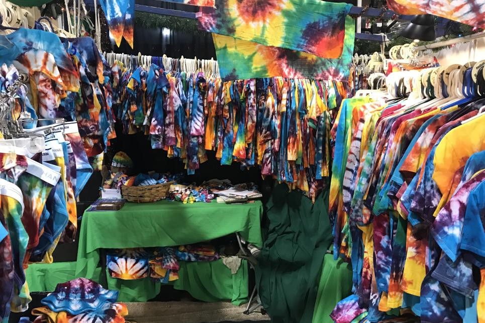 A booth full of tie dyed apparel at the Eugene Saturday market
