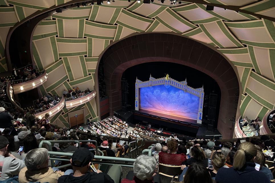 Looking down over the packed seats toward the stage.