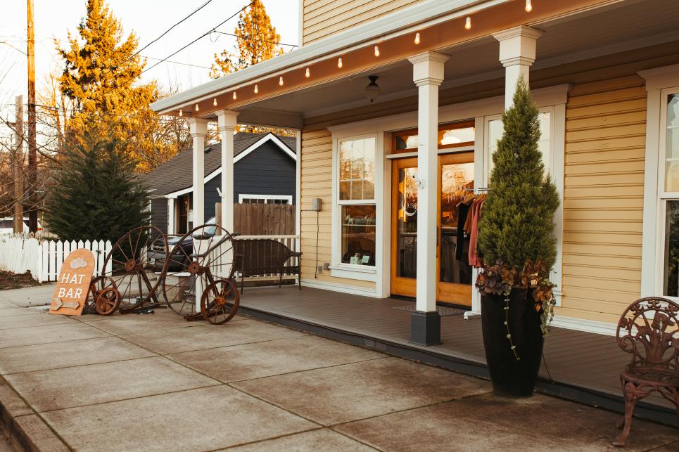 Front porch and exterior of Dawn + Dusk Hat Bar.