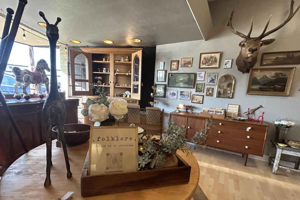 Antlers on the wall, a giraffe statue on the table and more artistically placed items complete a staged look.