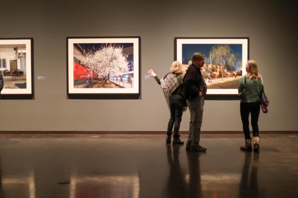 People look at the 24 Seasons exhibit at the Jordan Schnitzer Museum of Art.