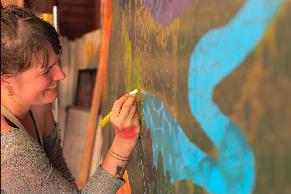 Artist Liza Burns painting the Oregon Cultural Trust License Plate design.