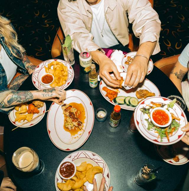 Table full of bar food and friends