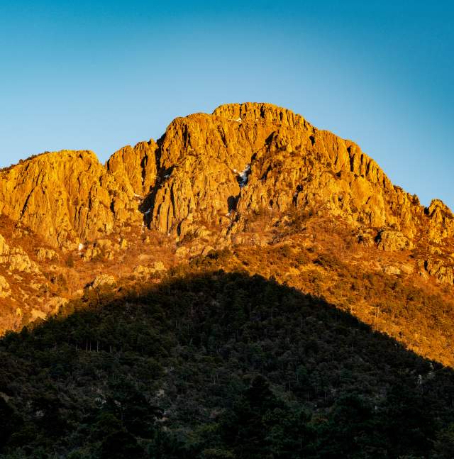 Santa Rita mountains in Tucson during golden hour - a shadow cast along the bottom of the range