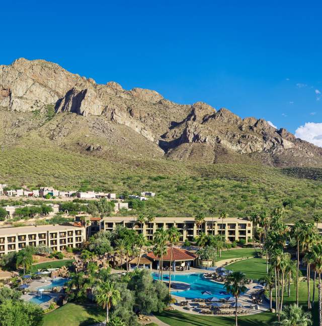 Overlooking resort and a mountain range.