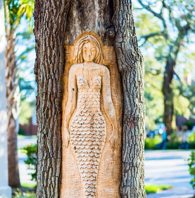 A mermaid tree carving is the most famous of the St. Simons Island Tree Spirits