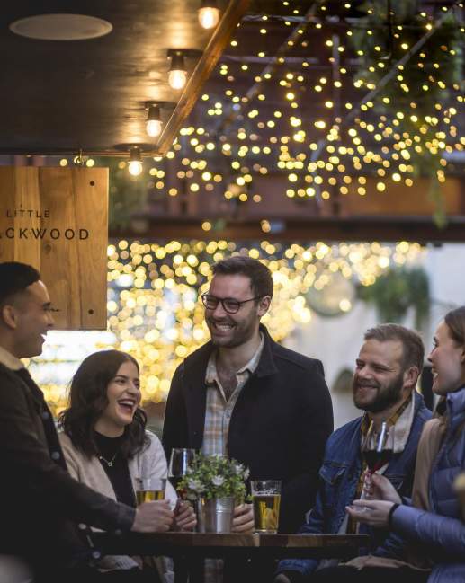 Group of people mingling at bar