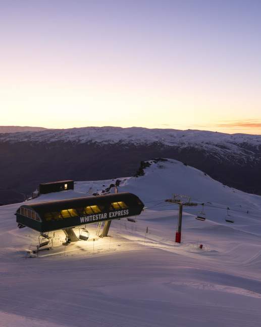 Chairlift on ski field at sunrise