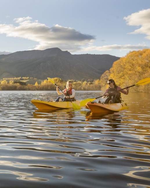 Friends Kayaking on Lake Hayes on an Autumn Day