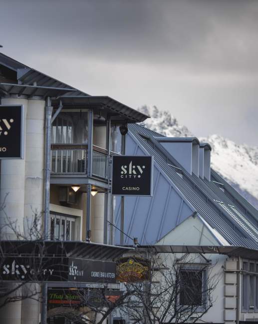 Outside view of Sky City Casino with snowy mountains in the background