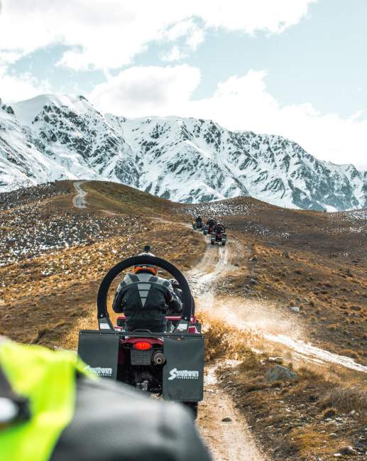 Quad biking on a dirt track at the top of a mountain