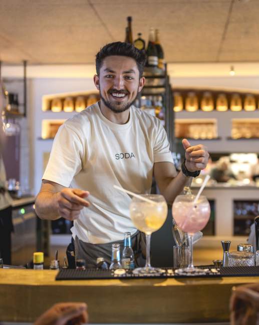 Person serving cocktails