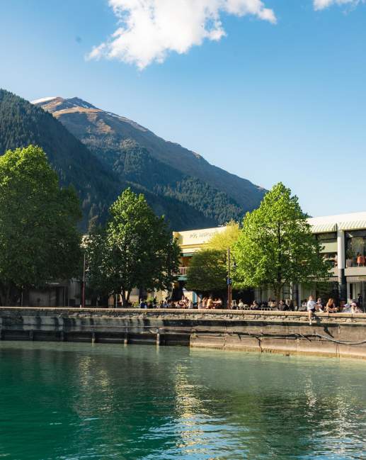 View from the lake looking at Queenstown Bay and busy waterfront