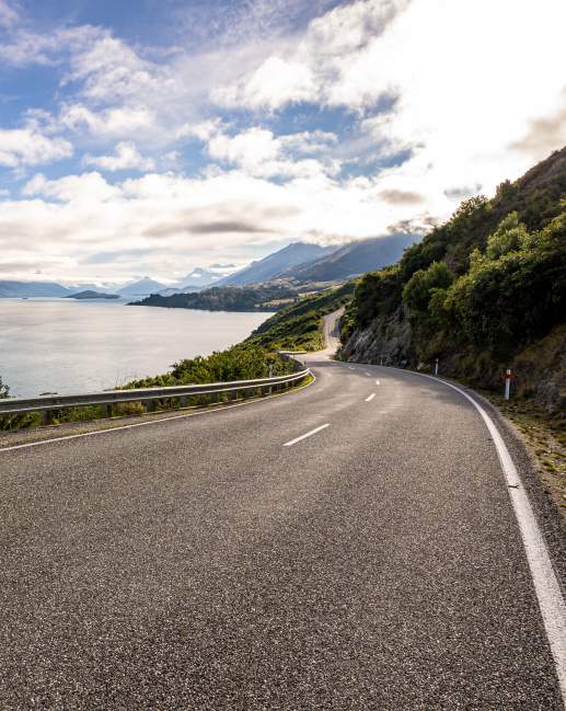 Iconic Queenstown Glenorchy Road with lake and mountain views